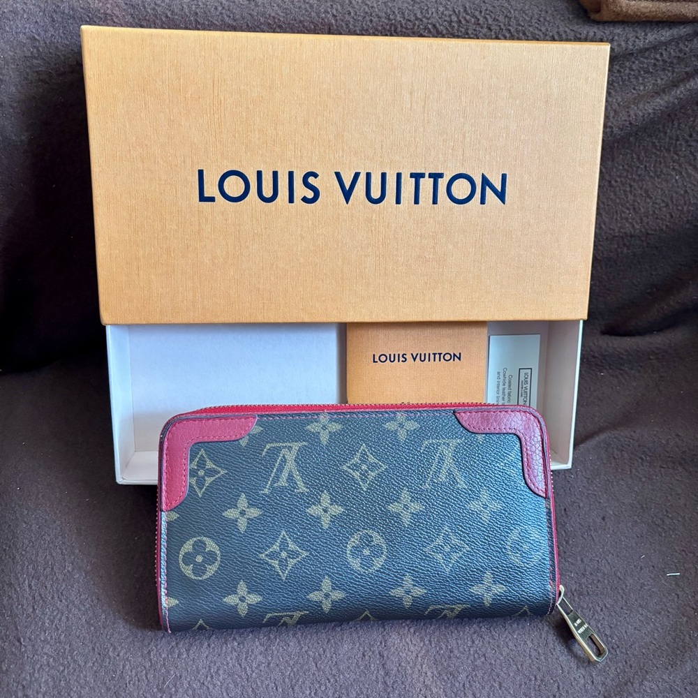 Louis Vuitton Zippy Wallet Retiro in Monogram Canvas with red leather accents